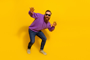Fototapeta na wymiar Full size photo of charismatic dancing ginger man have fun in nightclub isolated on yellow color background