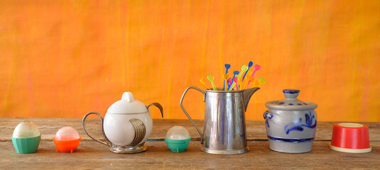 various vintage kitchen utensils from the seventies with vibrant colors, pop and trashy style...