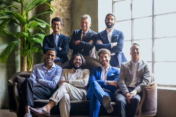 portrait of diverse businessmen, group of young and adult males working in the world of...