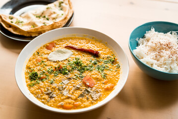 Traditional indian dal homemade. Traditional Indian soup lentils. Indian Dhal spicy curry in bowl...
