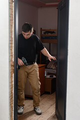 installation of a door handle using a manual screwdriver, assembly work.