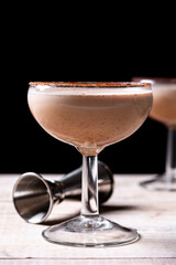 Brandy Alexander cocktail on wooden table	