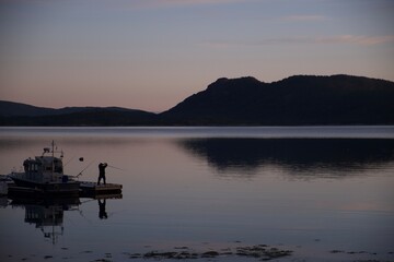 Fishing in sunrise in Norway