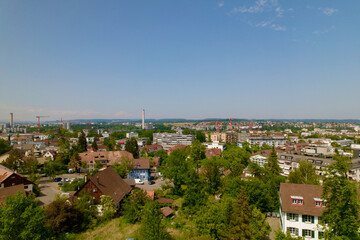 Fototapeta na wymiar Aerial view over City of Zürich seen from district Schwamendingen on a sunny hot summer day. Photo taken June 21st, 2022, Zurich, Switzerland.