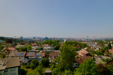 Aerial view over City of Zürich seen from district Schwamendingen on a sunny hot summer day. Photo taken June 21st, 2022, Zurich, Switzerland.