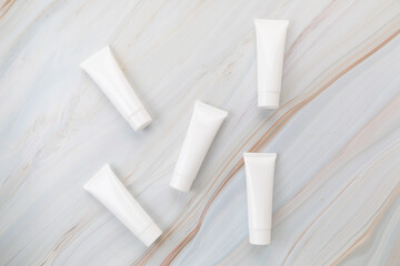 cream tube skincare package on background marble