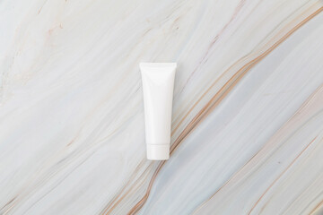cream tube skincare package on background marble