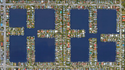 Cape Coral, Florida, settlement of the wealthy district with water channels and lake, looking down...