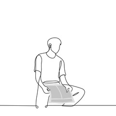man sits with a newspaper in his hands but looks away - one line drawing vector. concept reading a boring newspaper, a read newspaper, a censored article