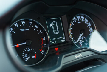 Modern car speedometer,odometer,tachometer and illuminated dashboard. car dashboard modern automobile controlilluminated panel speed display.Car instrument panel.Close up.Selective focus.