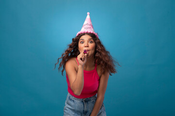 Young woman wearing party hat