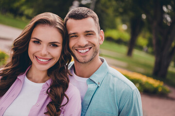 Obraz premium Photo of shiny sweet young wife husband dressed pastel shirts walking hugging enjoying sunshine outdoors backyard