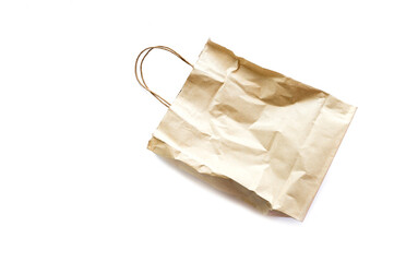 Naklejka premium Brown wrinkled paper bag isolated on white background.