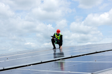 Engineer working setup Solar panel at the roof top. Engineer or worker work on solar panels or solar cells on the roof of business building	