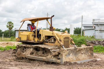 Fototapeta premium Engineer or Worker operator driving excavator on construction building site 