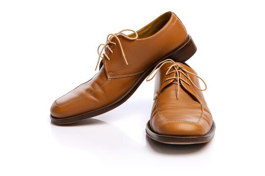 Male brown classic style shoes over white background. Vintage dress shoes. Concept of ad, sales , fashion, retro vintage style