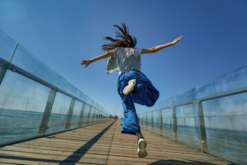 Outdoor photo of young caucasian teenager in Zelenogradsk. - obrazy, fototapety, plakaty