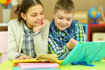 Brother and sister doing homework together