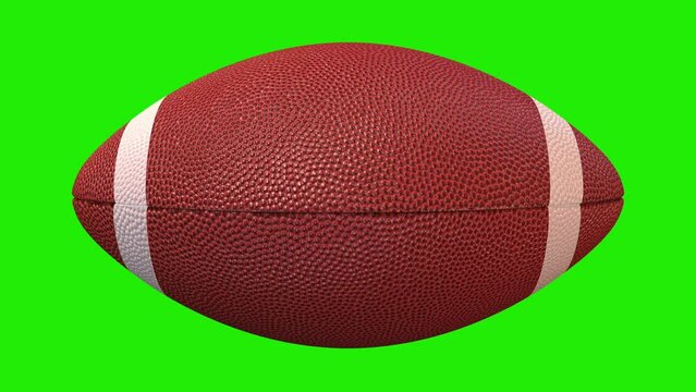 American football ball spinning around itself  animation on a green background. American Football Ball with alpha channel, Key color, chroma-key, alpha channel.