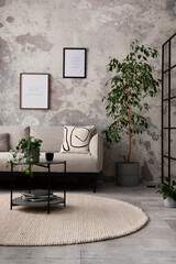 The stylish compostion at living room interior with design gray sofa, coffee table, plant, hanger, lamp and elegant personal accessories. Loft and industrial interior. Mock up poster. Template. .