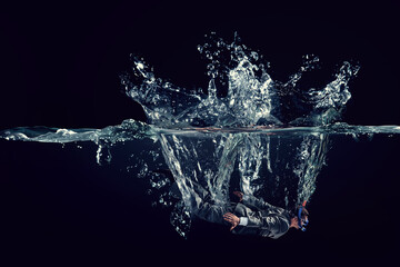 Funny businessman swimming underwater . Mixed media