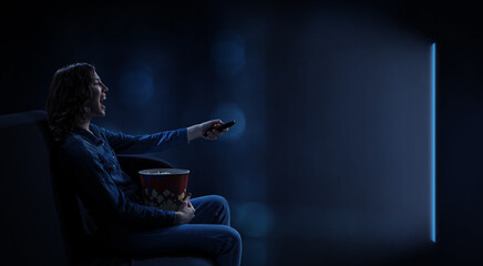 Young woman watching movie . Mixed media