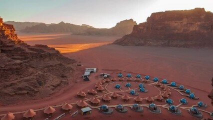 Timelapse view first human colony on Mars with glass domes construction and tents at sunset time. - Powered by Adobe