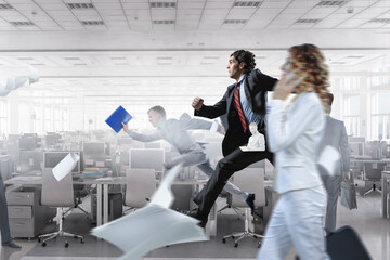 Portrait of energetic businessman running