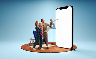 Happy family standing in front of huge 3d model of smartphone with empty white screen isolated on...