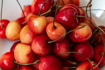 Lots of ripe fresh cherries with a tail. Cherry background. Close-up. Healthy food. Vegan breakfast.