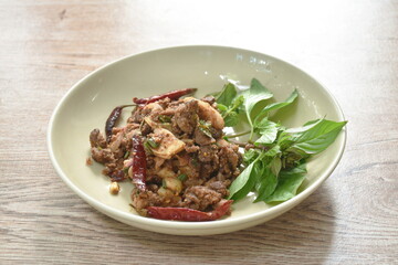 Thai spicy slice beef salad eat couple fresh basil on plate