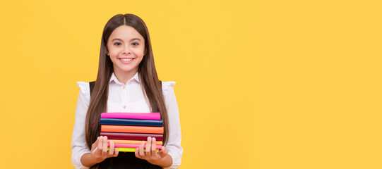 happy teen girl in school uniform hold book stack, reading. Banner of school girl student. Schoolgirl pupil portrait with copy space.