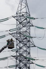 Supports of power transmission lines, insulators and wires. The appearance of the structure....