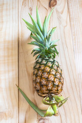 Healthy food pineapple on wood table.