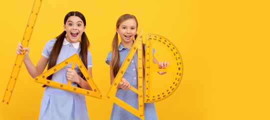 School girls friends. Happy teen girls hold geometric tools. School education. Learn and grow together. Banner of school girl student. Schoolgirl pupil portrait with copy space.