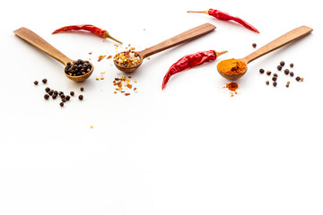 Powdered spices and herbs in wooden spoons. Colorful cooking background