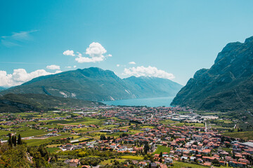 Fototapeta na wymiar Riva del Garda with Lago di Garda in summer, Alps in Italy