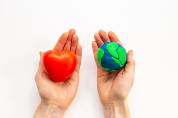 Plasticine world - planet Earth in hands. Eco care concept