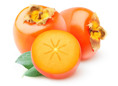 Halved persimmon fruits isolated on white background