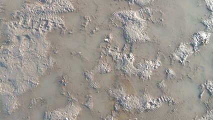 Dirty wet sand, grunge horizontal shabby background close-up. Blurry image of sand pattern....