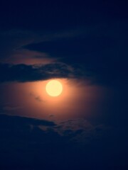 full moon surrounded by the dark cloud