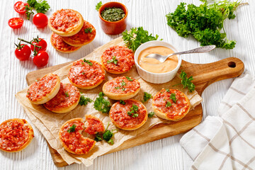 mini pizzas with ham and pecorino cheese, top view