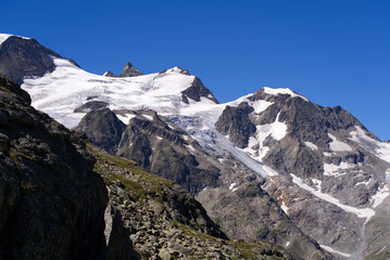 Beautiful scenic view of mountain panorama with Stone Glacier at Swiss mountain pass Susten on a sunny summer day. Photo taken July 13th, 2022, Susten Pass, Switzerland.