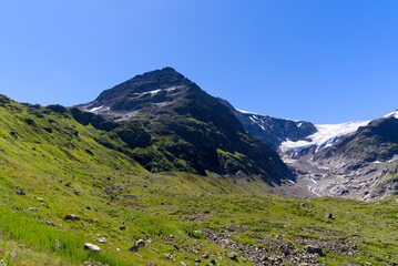 Beautiful scenic view of mountain panorama with Stone Glacier at Swiss mountain pass Susten on a sunny summer day. Photo taken July 13th, 2022, Susten Pass, Switzerland.