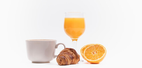 Freshly baked croissant with orange juice and coffee