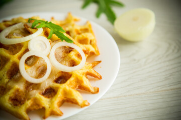 fried potato cheese vegetable waffles with bacon and onions