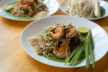 Close-up of Pad Thai Seafood, a dish made from noodles, is a famous dish of Thailand recommended for tourists visiting the country. It consists of rice noodles and shrimp and squid.
