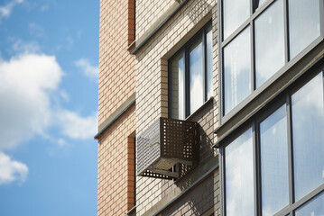 Obraz premium Facade of apartment building with decorative air conditioner covers