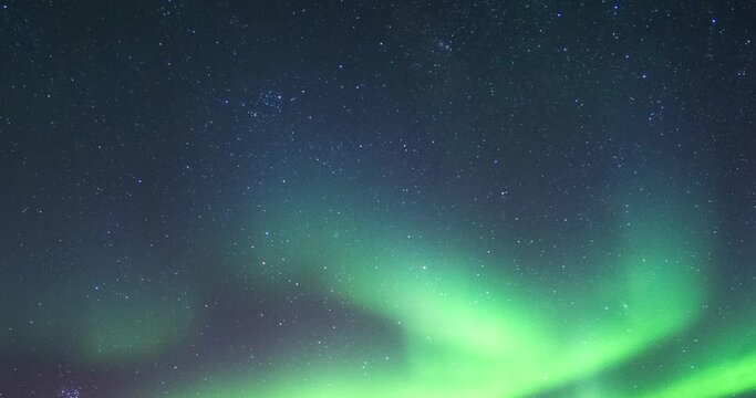 Aurora Borealis, Northern Lights with stars in the night sky on Arctic Circle at North Pole