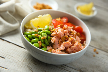 Healthy salmon poke with edamame beans